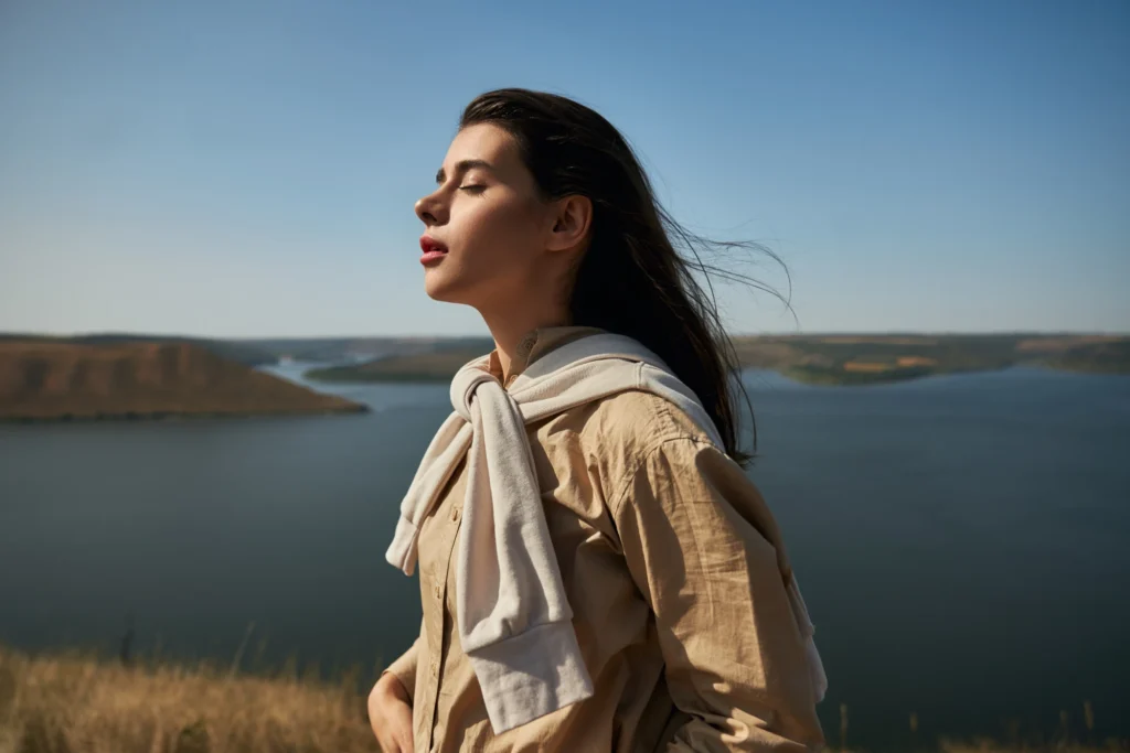 Breathe Away Anxiety: How 5 Minutes a Day Can Calm Your Mind and Body woman enjoying nature national park podillya tovtry